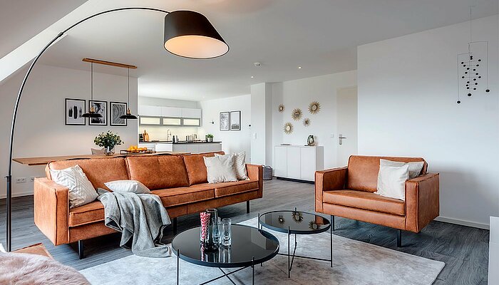 [Translate to italian:] Eingerichtetes Wohnzimmer