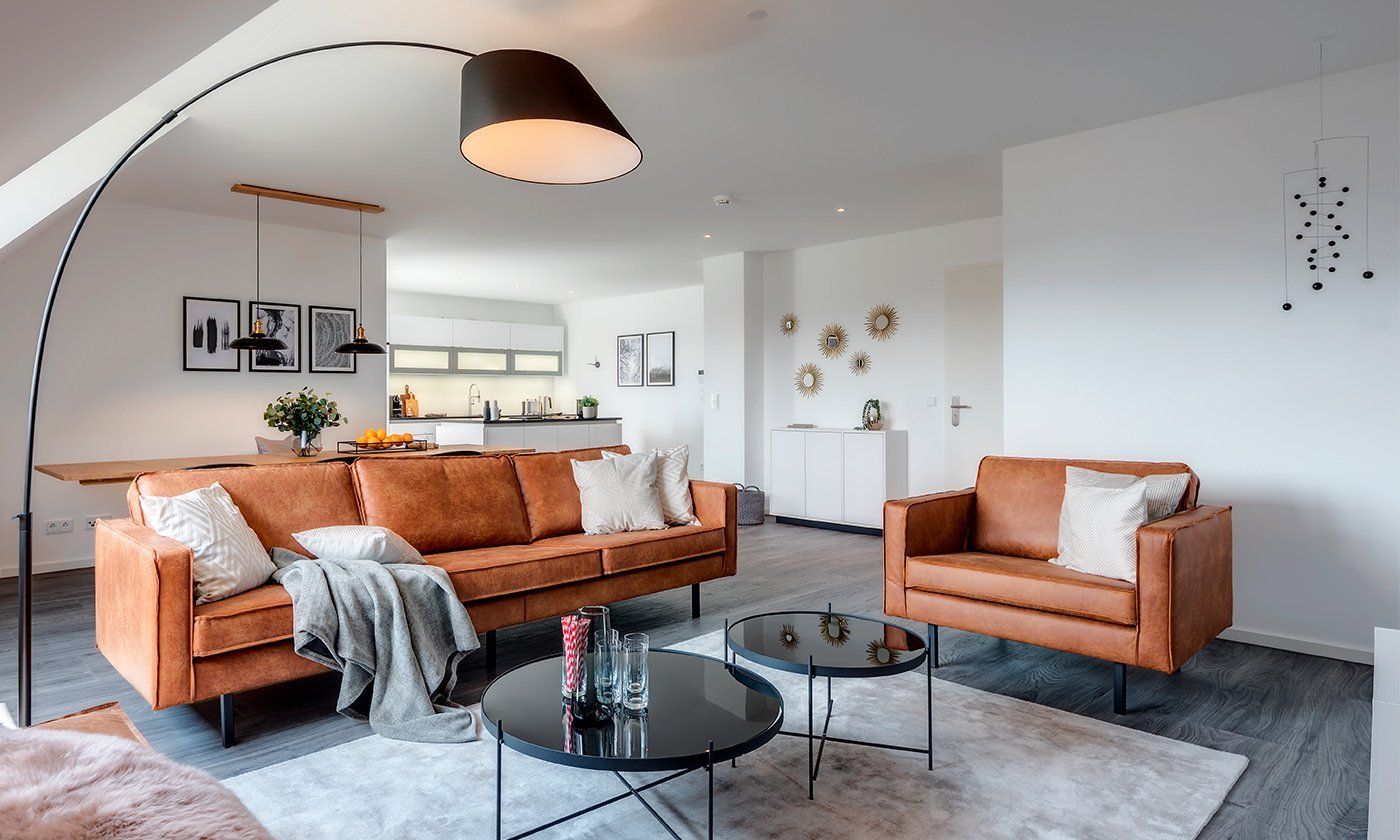 [Translate to italian:] Eingerichtetes Wohnzimmer